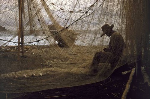 Caribbean fisherman mending